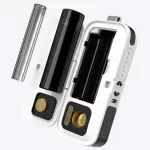 Open white and black vape device with two cartridge slots and metal mouthpiece removed, showing internal battery compartments (vaping kit)