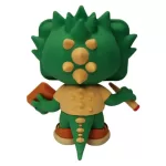 Back view of a green, spiky-headed toy figure holding a small brown book in one hand and a stick-like object in the other.