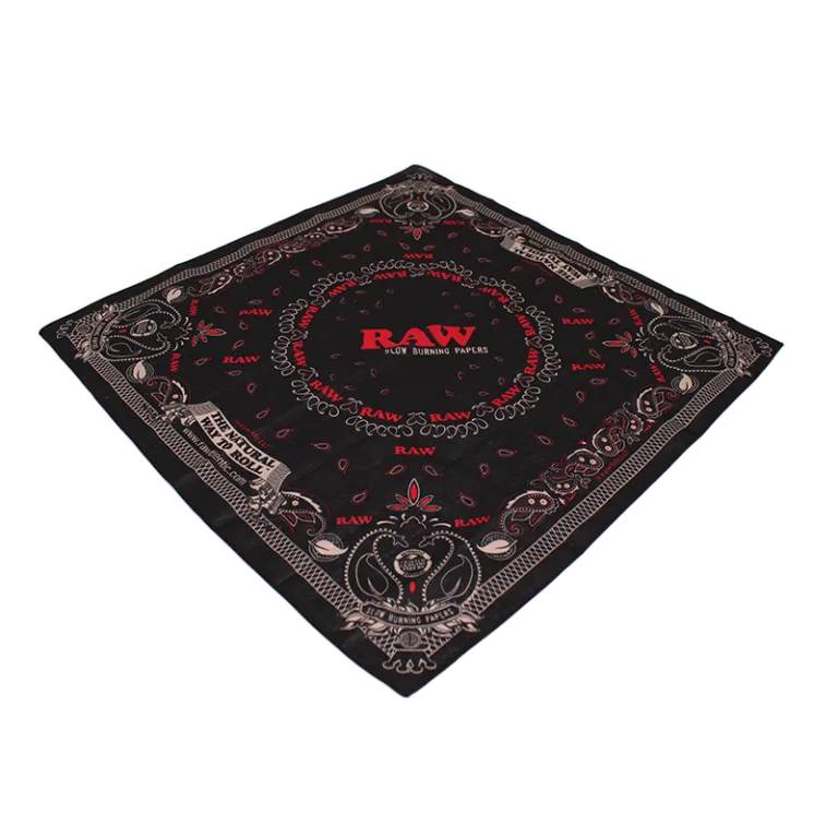 Black bandana with red and white paisley pattern and RAW branding in the center